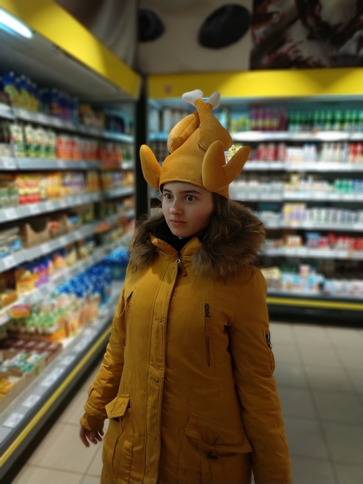 Maya Clars, chicken, chicken hat, hat, yellow outfit, yellow jacket, supermarket, music, songs, Spotify, apple music, playlist 